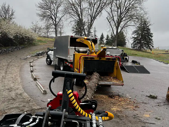 Land clearing in Indian Hills, CO: chipper set up for brush clearing