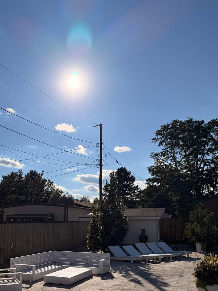 After tree removal and stump grinding in Wheat Ridge, CO: the patio in full sun with both cottonwoods and their stumps gone